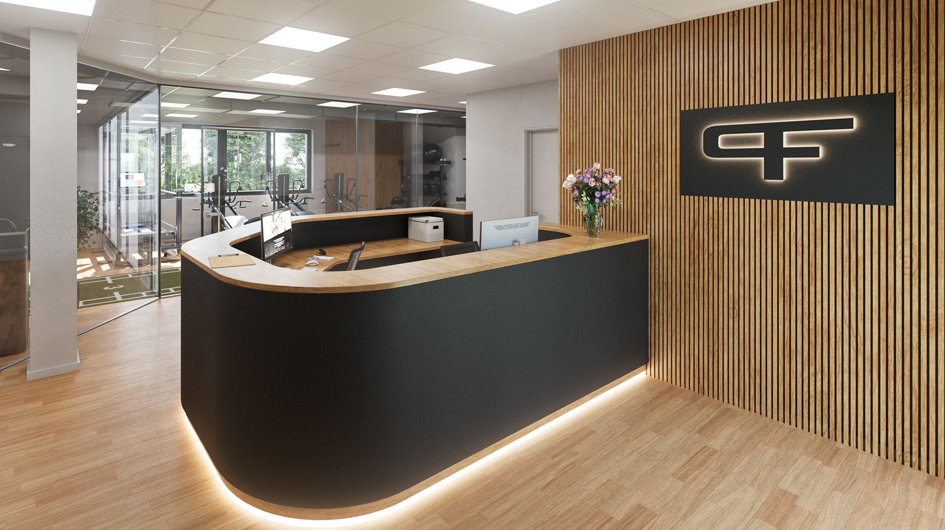 Moderner Empfangsbereich mit geschwungener Theke in Schwarz und Holz, beleuchtetem Logo an der Wand und Blick in den Trainingsraum mit Glasfront
